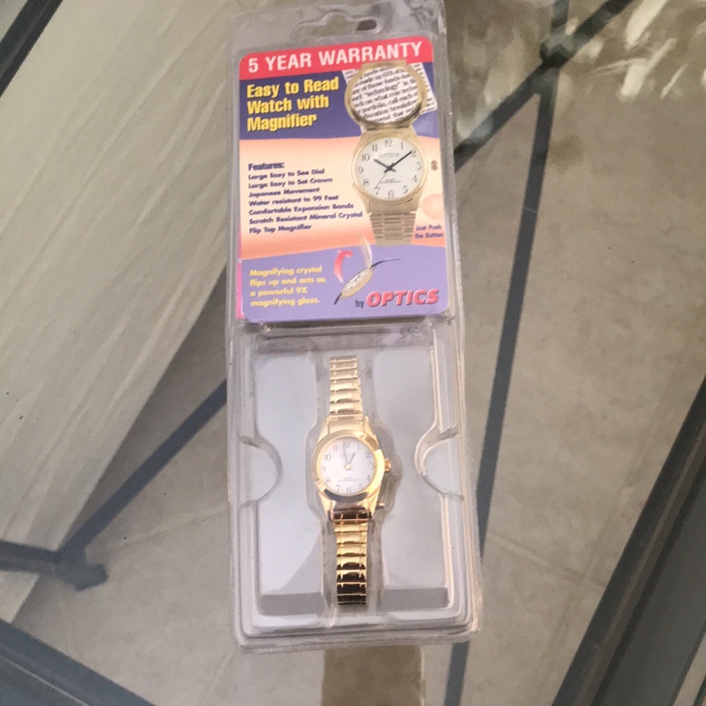 Optics quartz watch. Gold stretchy band, magnifying crystal NEW classic